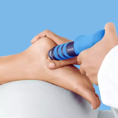 Patient receives shockwave therapy with a chiropodist or podiatrist at our Markham foot clinic